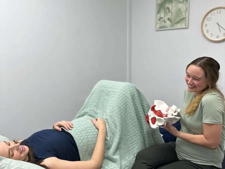 Forward Health pelvic floor physiotherapist with a pregnant patient