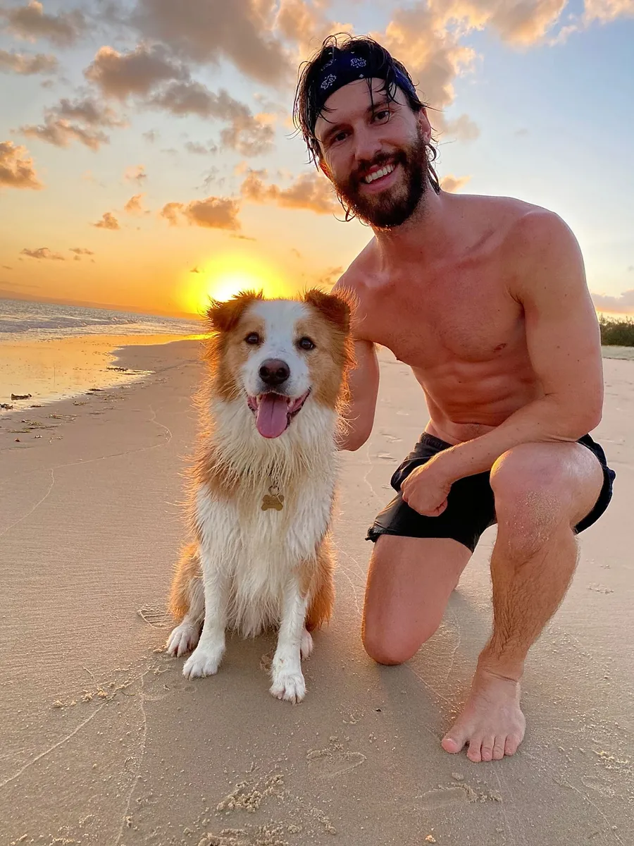 Joe (Forward Run Club lead) and Fraser (his border collie and the Run Club mascot) at sunrise on the beach