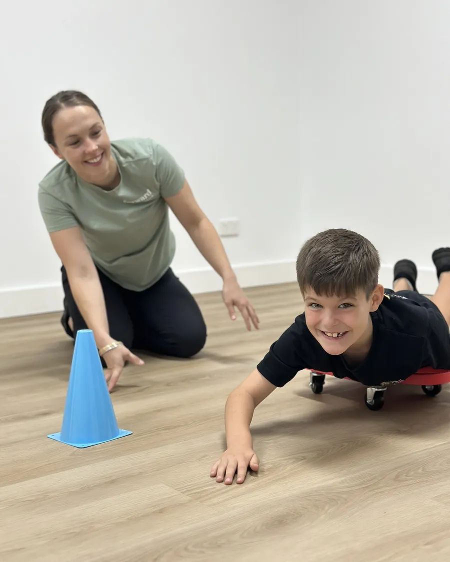 Forward Health paediatric physiotherapist with a young patient