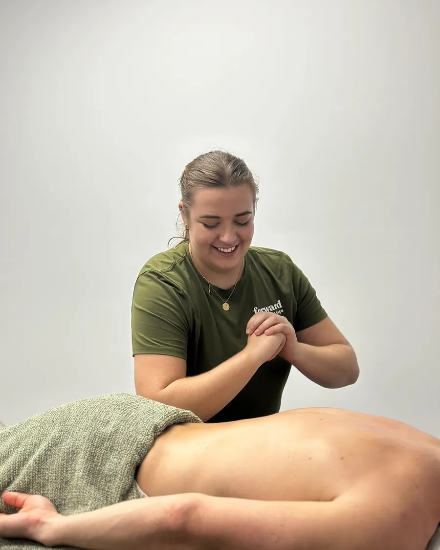 Forward Health remedial massage therapist working on a client